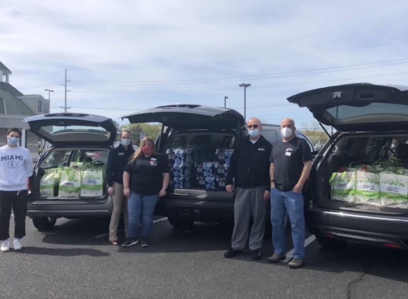 Giant Food staff donated trunks of food and bottled water to a local food drive. Pictured are (l-r) Cape Henlopen Leo Club volunteer Jack Lee and Giant Food’s Carleigh Walters, Emily Edick, Rob Willey, and Jamie Middleton. SUBMITTED PHOTO